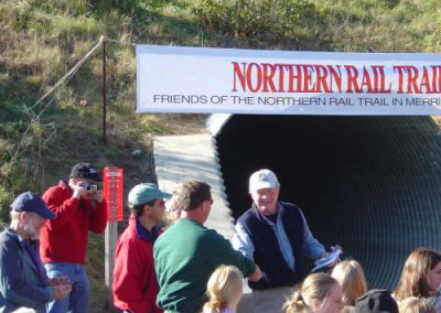 Craig Mayo accepts a golden spike in appreciation for the help the Andover Snowmobile Club provided in preparing the rail bed for this day.