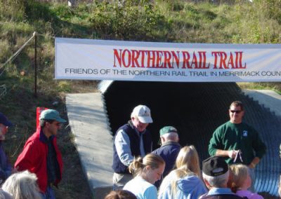 George Burdick accepts a golden spike in appreciation for all the time and energy he has donated to the Northern Rail Trail.